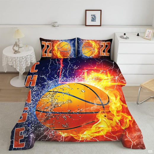 thematic accent graphic divided between fiery blaze and splashing liquid on navy and orange bedding set.
