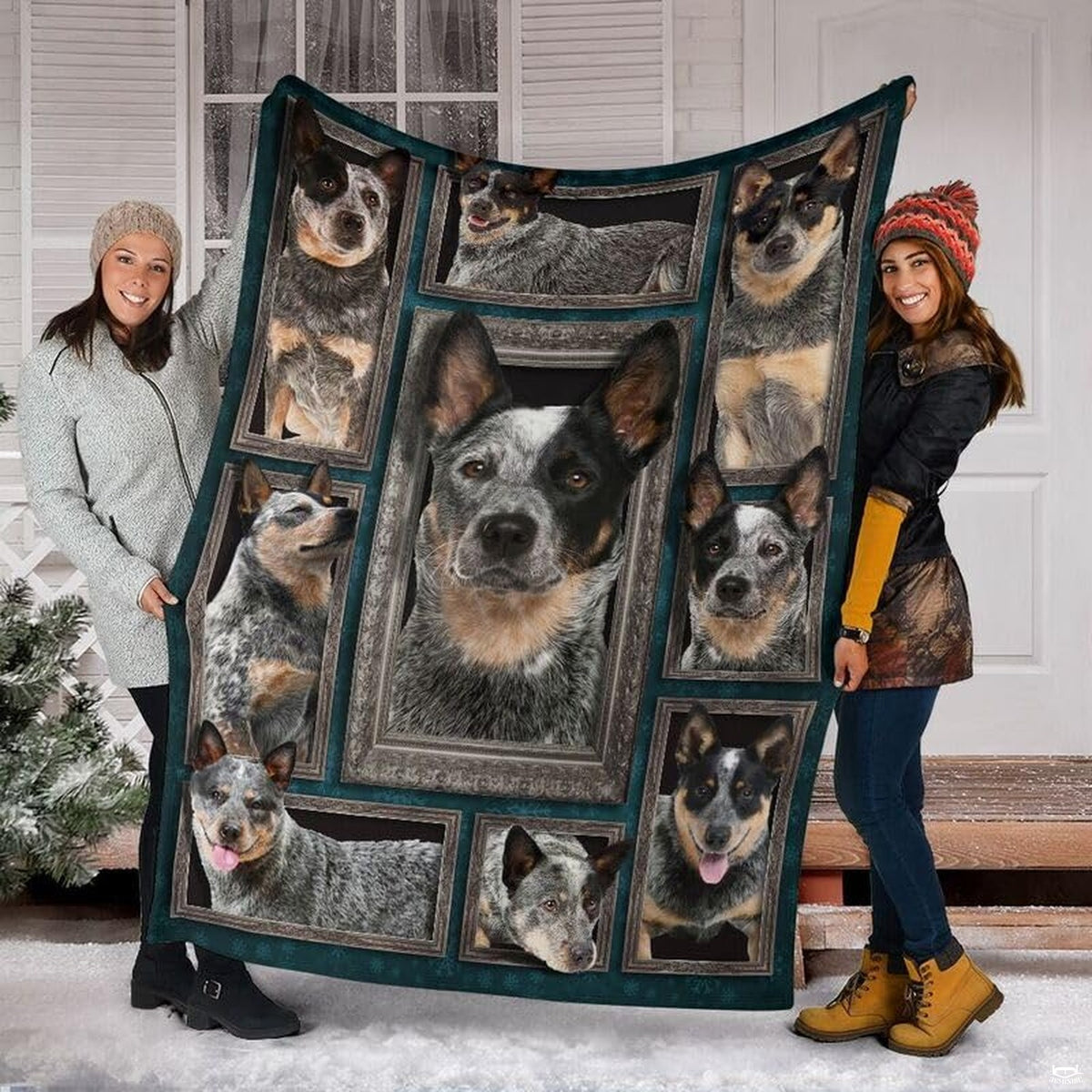 Two models displaying the Australian Cattle Dog blanket outside a snowy winter home entrance.