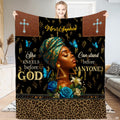 Faith art blanket featuring a regal woman in ornate headwrap with cross emblems and blue flowers.