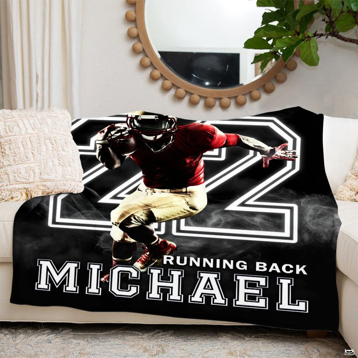 Athletic varsity ball carrier graphic blanket draped across bedroom bed