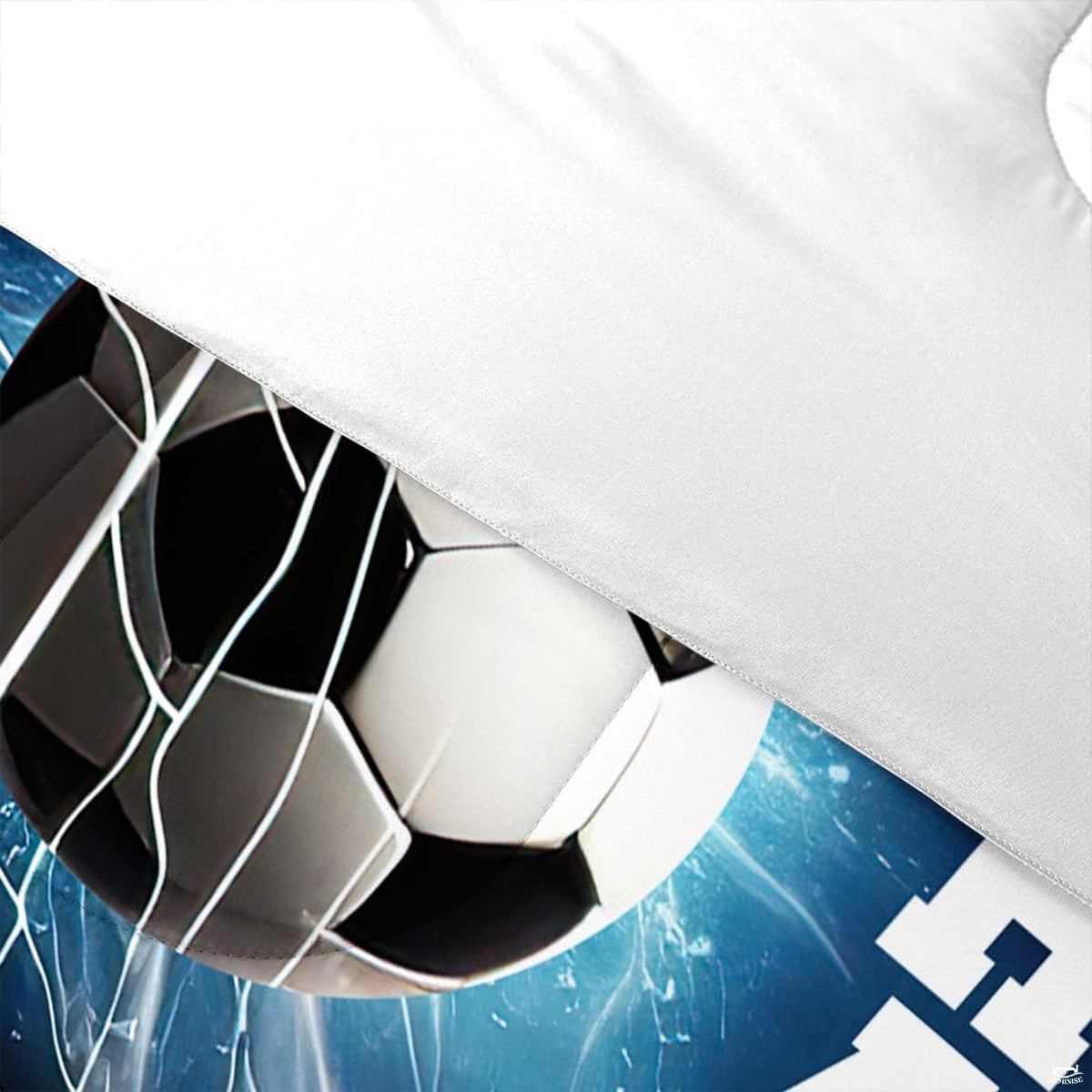 Side angle view of royal navy soccer bedding styled with athletic room accents and furniture