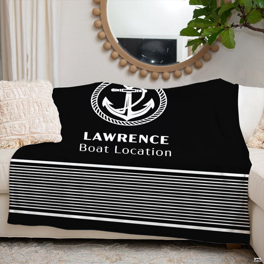 Nautical anchor print displayed across a living room couch beneath a round wall mirror.