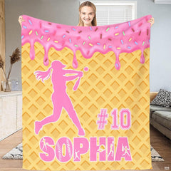 Athletic softball batter mid-swing over waffle cone pattern with dripping pink frosting and multicolored sprinkles.