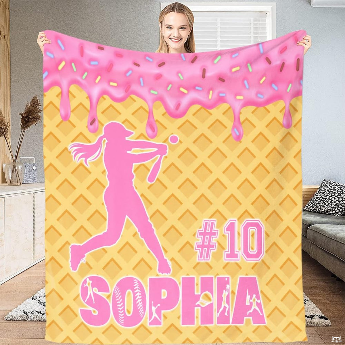 Athletic softball batter mid-swing over waffle cone pattern with dripping pink frosting and multicolored sprinkles.
