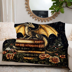 Lifestyle setting displaying the dragon book stack throw blanket neatly folded on an armchair.