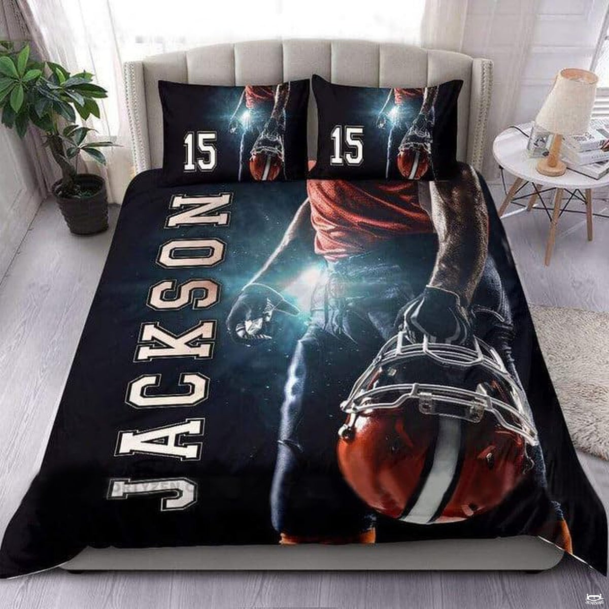 Silver and blush coral football sports bedding featuring textured football graphic and yard lines on a bed