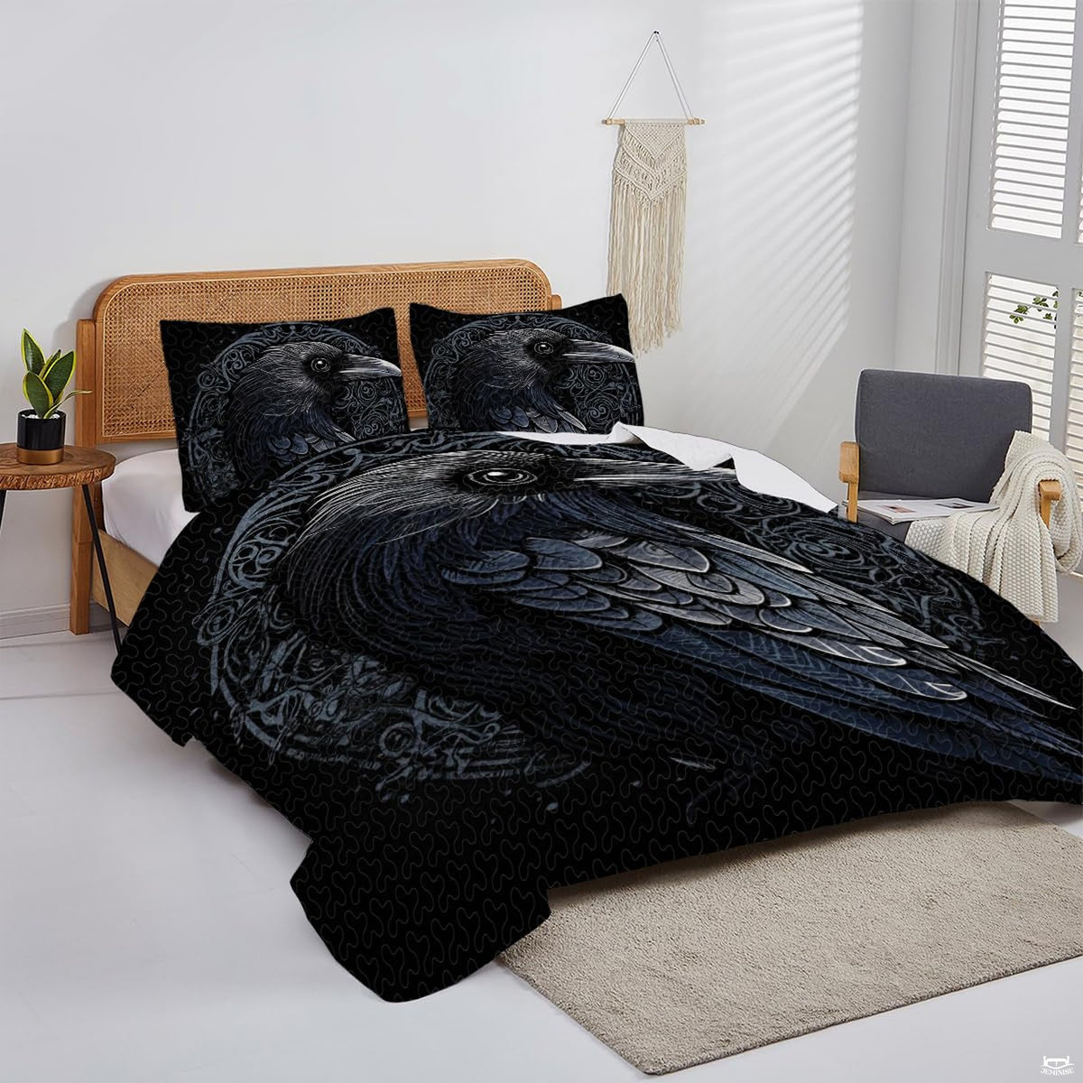 Overhead perspective of Norse raven bedding arranged neatly across a mattress with dark room decor