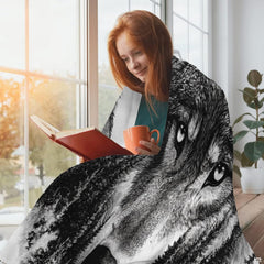 Detailed wolf face and evergreen pine tree double exposure illustration on a white bed spread.