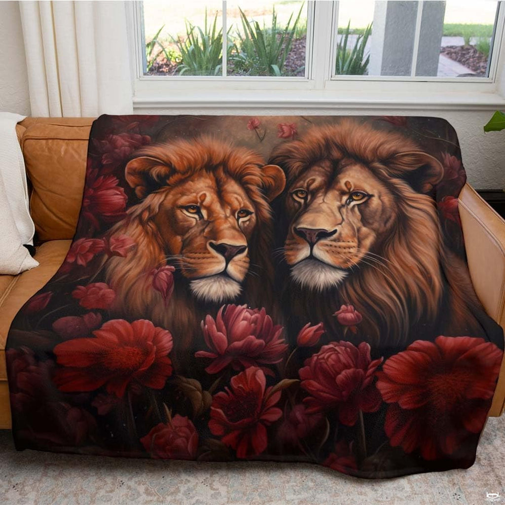 Close-up perspective of lion manes and deep burgundy peony petals on throw blanket