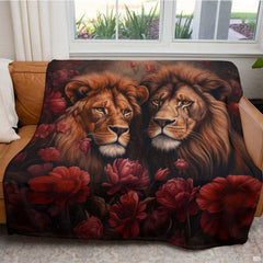 Close-up perspective of lion manes and deep burgundy peony petals on throw blanket