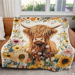 Upper floral arch featuring yellow and orange wildflower sprays framing the top of the decorative throw