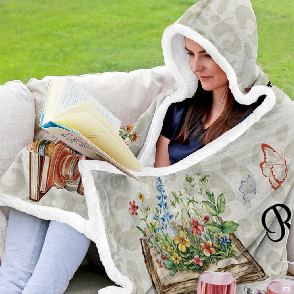 Chibi reader girl floral blanket draped during quiet outdoor reading session.