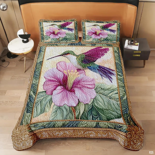 Overhead view of framed hummingbird and large pink hibiscus artwork