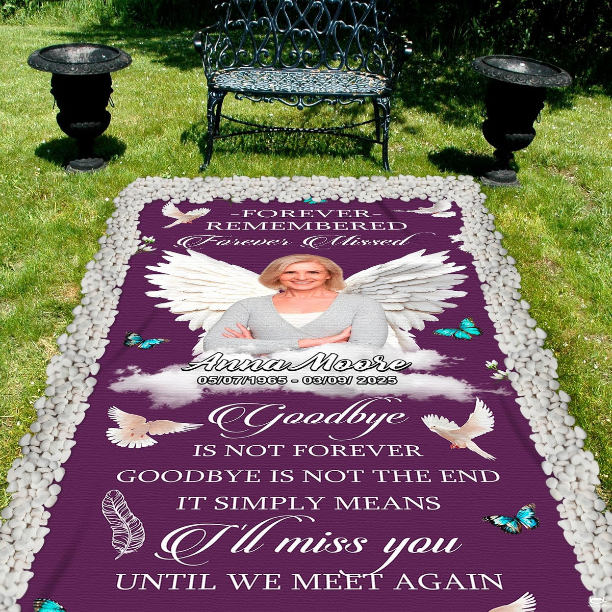 Purple memorial throw blanket laid out on outdoor grass near vintage garden park bench