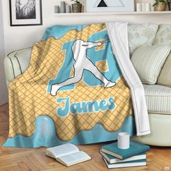 Memorial blanket featuring angel wings and cardinal graphic laid across bedroom bedding.
