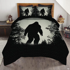 Midnight moonlit Bigfoot Sasquatch woodland bedding set displayed on a bed in a rustic cabin bedroom