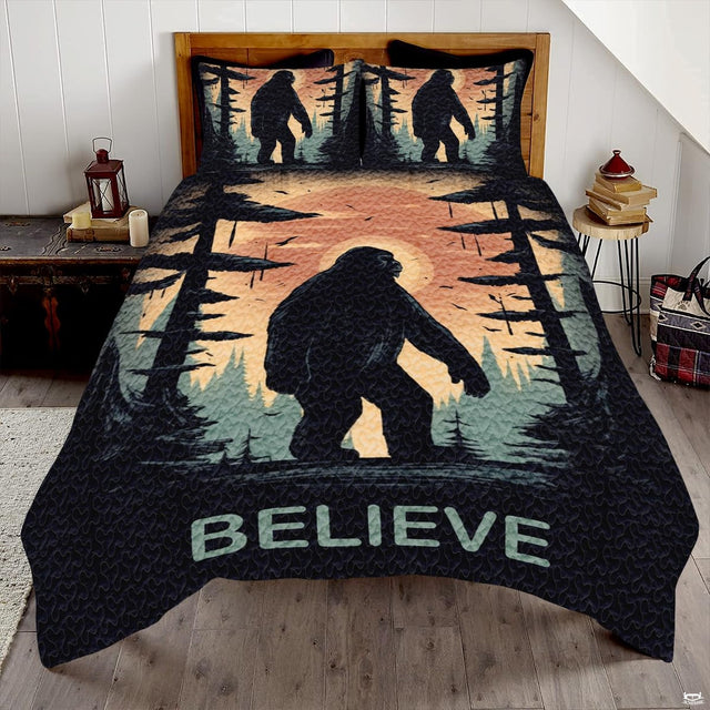 Sunrise glow Bigfoot Sasquatch woodland bedding set displayed on a bed in a rustic mountain lodge