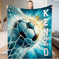 Soccer ball hitting goal net with stadium lighting and cyan streaks throw blanket