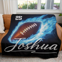 thematic accent overhead view of the blue flame football artwork styled atop a minimalist bed frame set.