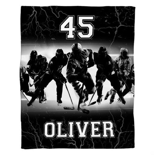 Ice hockey team blanket showing charging players surrounded by electric lightning strikes.