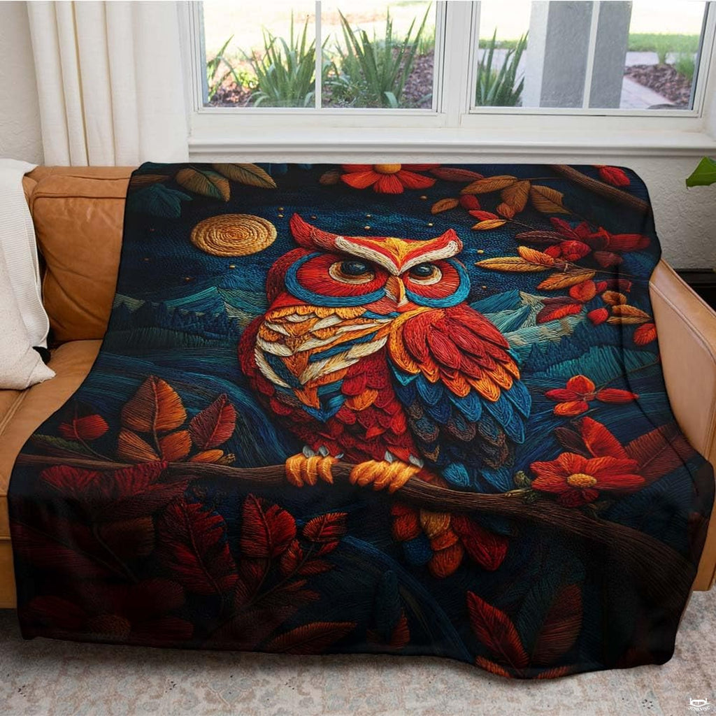 Overhead flat view displaying full nocturnal mountain owl artwork on a throw blanket