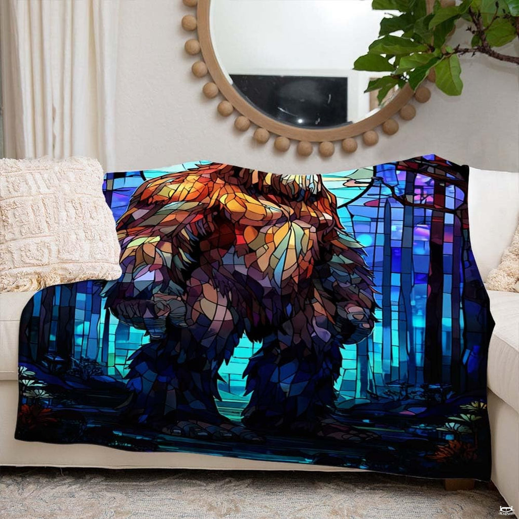 Lifestyle display of the colorful stained glass Bigfoot blanket in a room.
