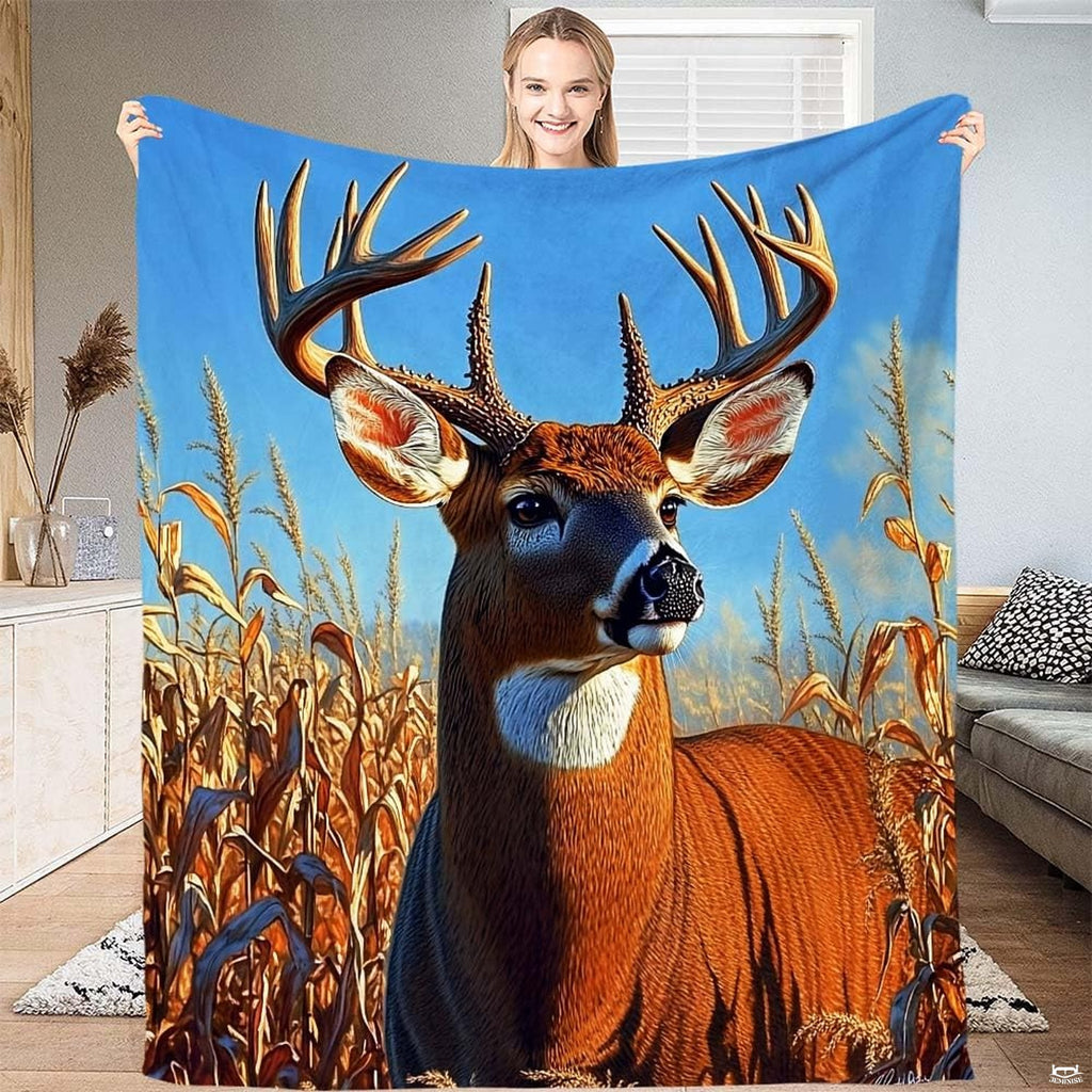 Whitetail buck deer portrait with magnificent antlers in a golden autumn cornfield under blue sky on a throw blanket