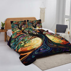 Overhead view of stained glass sacred tree bedding arranged neatly across a rustic wooden bed frame