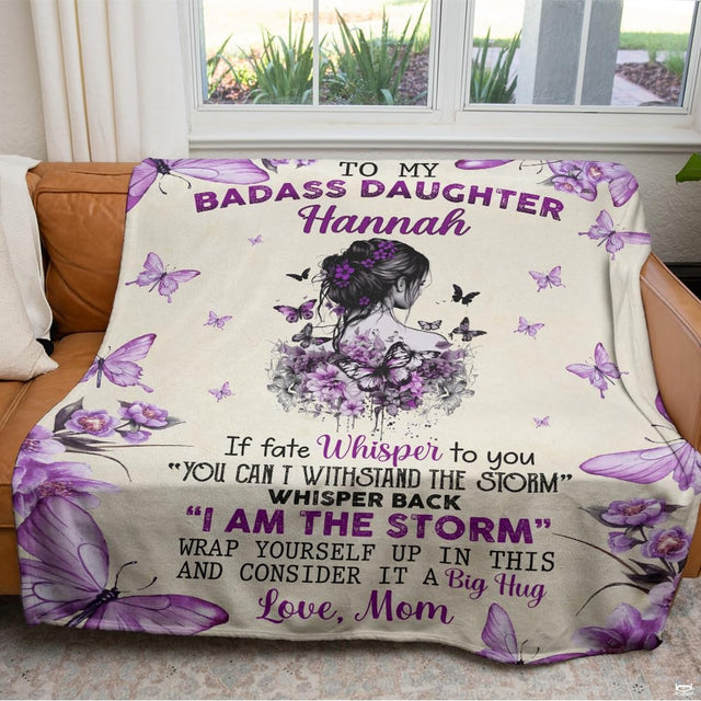 Close-up of uplifting motivational typography and delicate violet butterflies on a daughter blanket
