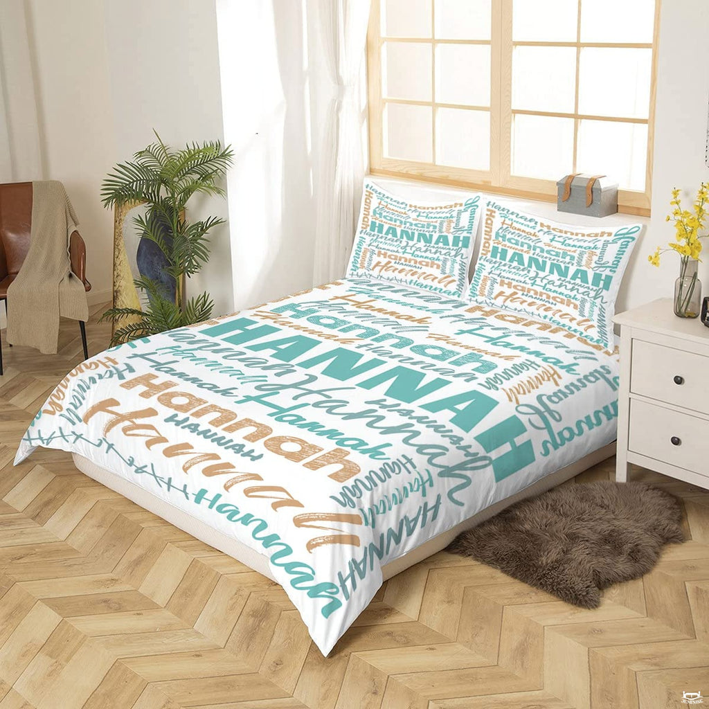 Close-up perspective of turquoise typography bedding showing textured chalk lettering and calligraphy brushstrokes