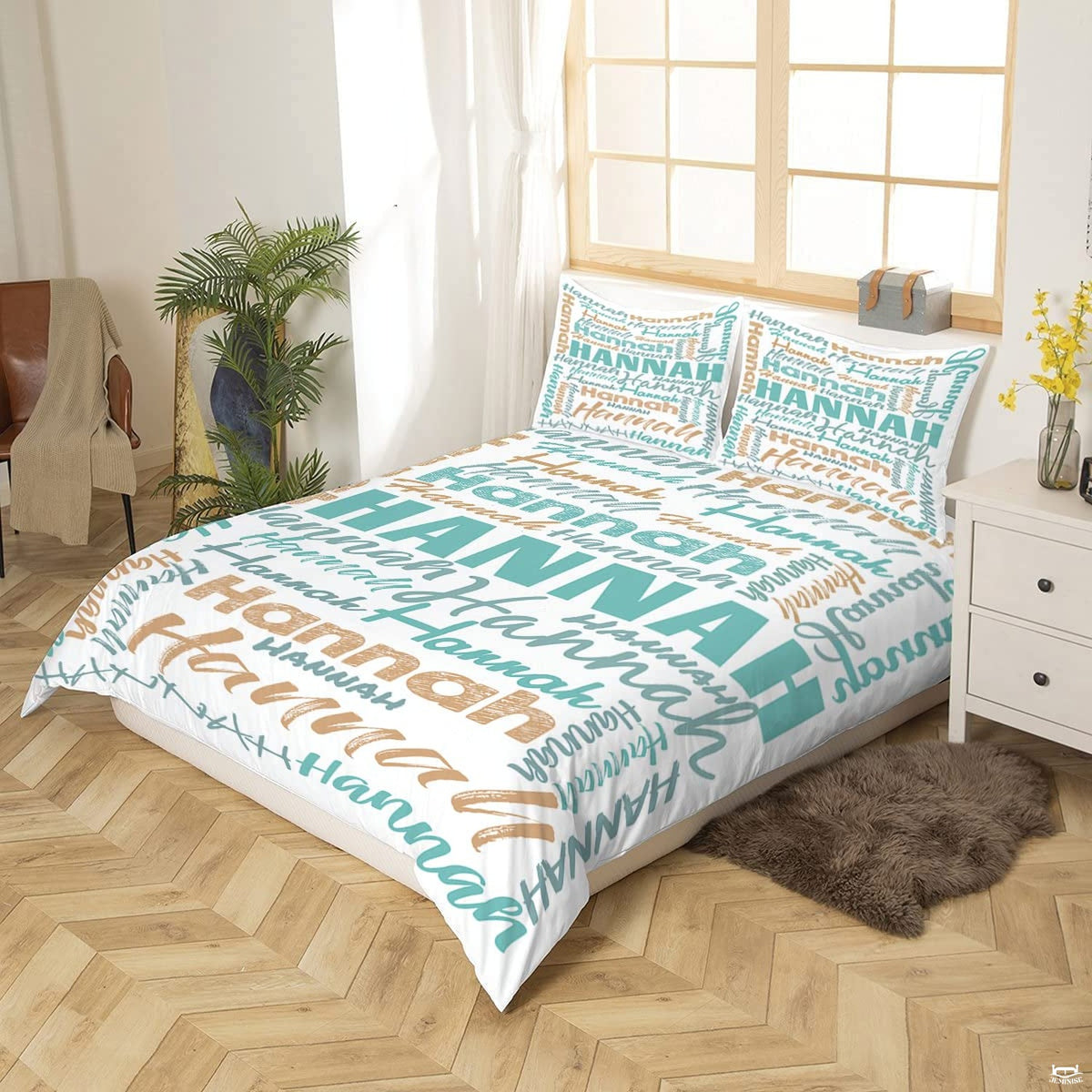 Close-up perspective of turquoise typography bedding showing textured chalk lettering and calligraphy brushstrokes