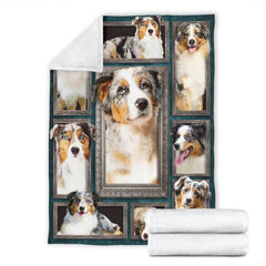 Folded corner and rolled layout of the Australian Shepherd blanket showing the white reverse side.