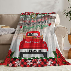 Detailed view of vintage pickup and colorful flowers framed by winter holiday motifs.