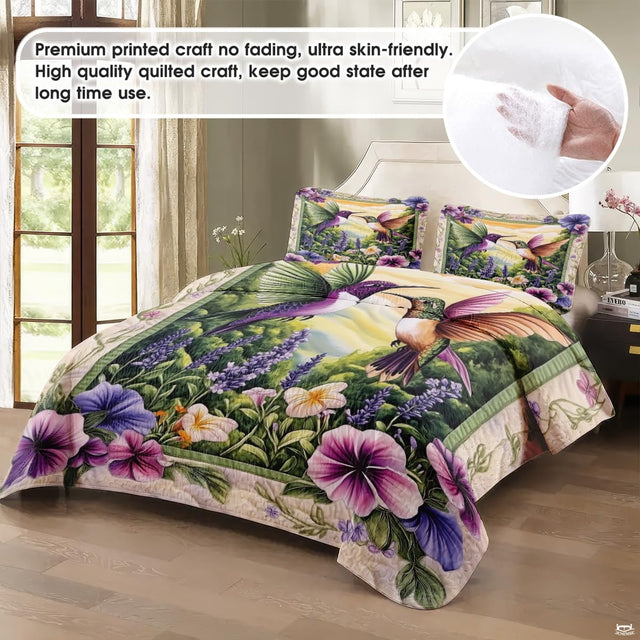 Close-up view of hummingbird bedding showcasing wildflower motifs and sage green botanical tones