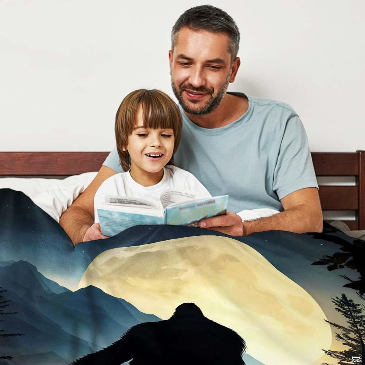 Detailed artwork showing Sasquatch among alpine evergreens in rich indigo nocturnal tones.
