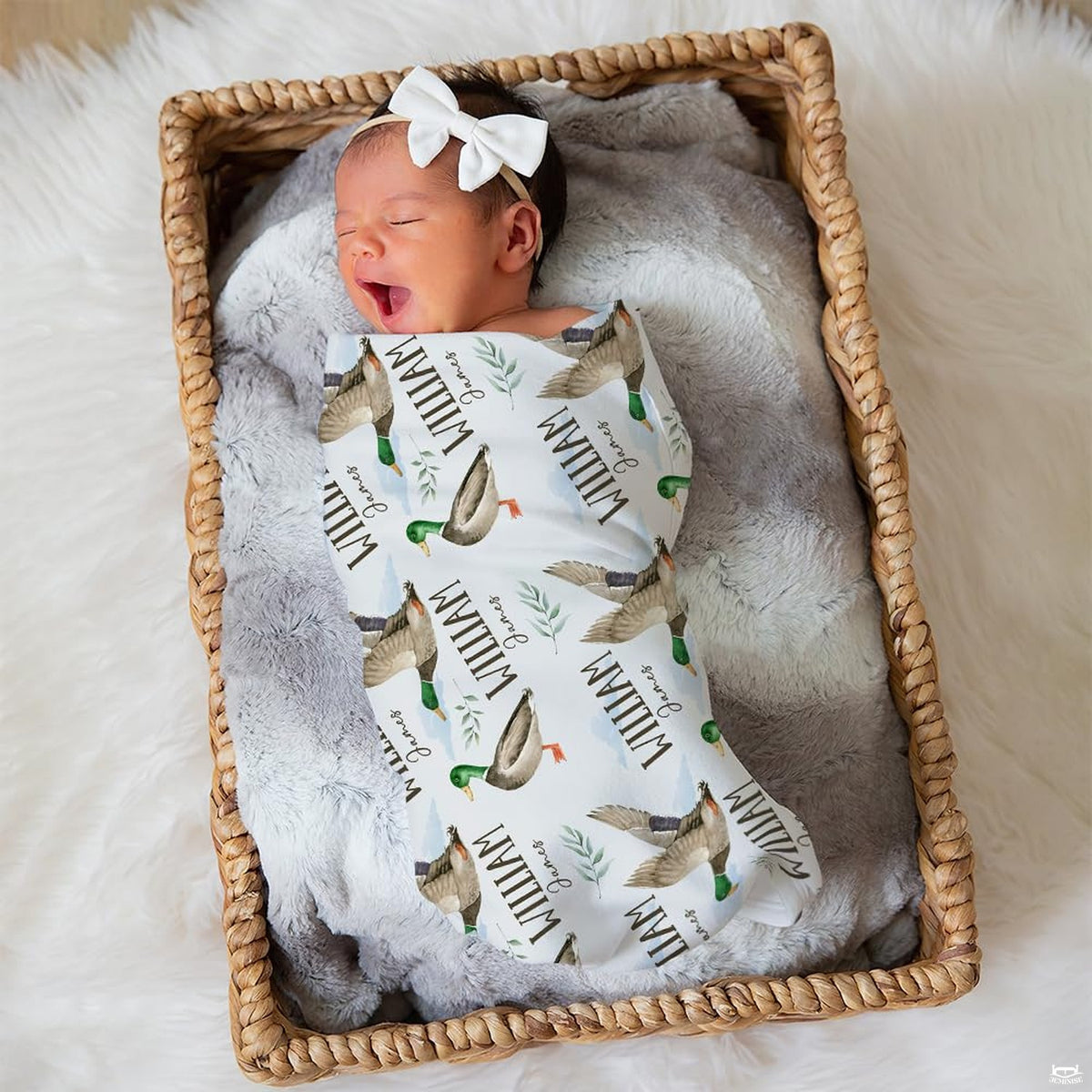 Scenic lakeside waterfowl print bedding styled with wooden bedroom furniture and country outdoor design accents