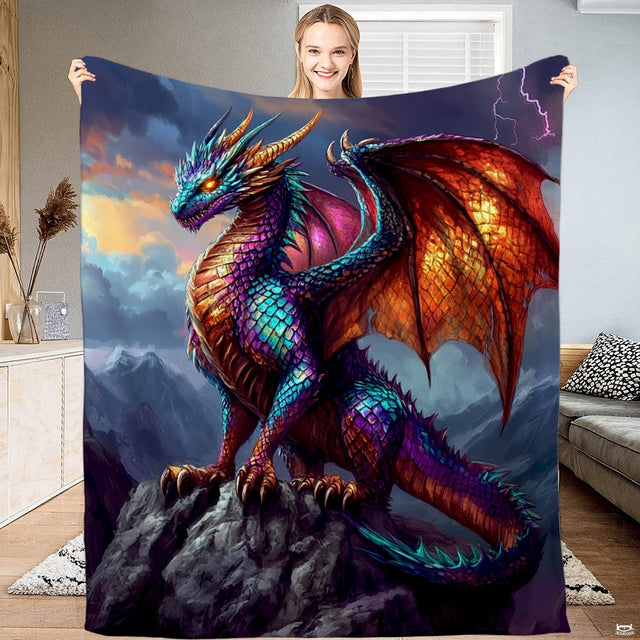 Vibrant fantasy artwork of a chromatic winged dragon perched atop a jagged mountain cliff.