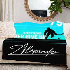 Contemporary sports bedroom arrangement highlighted by vibrant blue and black bedding.