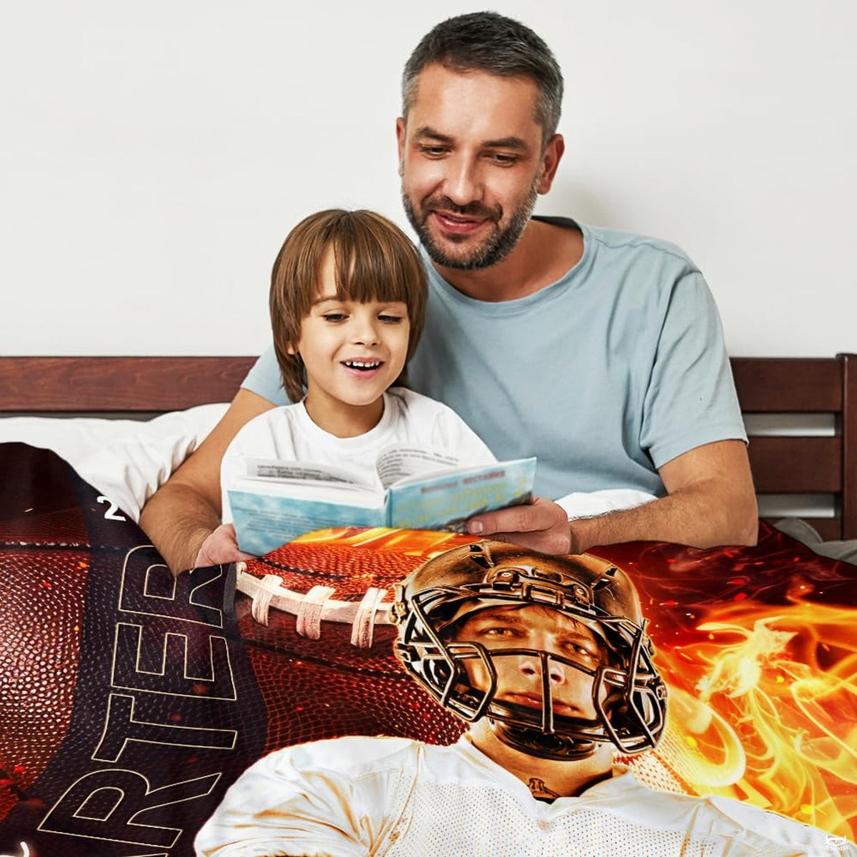 Athletic gridiron fire graphic blanket draped across bedroom bed