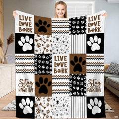 Chocolate brown dog paw print patchwork throw blanket with bold puppy paws and chevron zigzag blocks