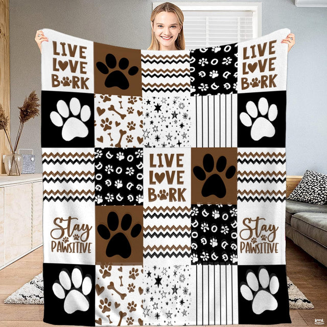 Chocolate brown dog paw print patchwork throw blanket with bold puppy paws and chevron zigzag blocks