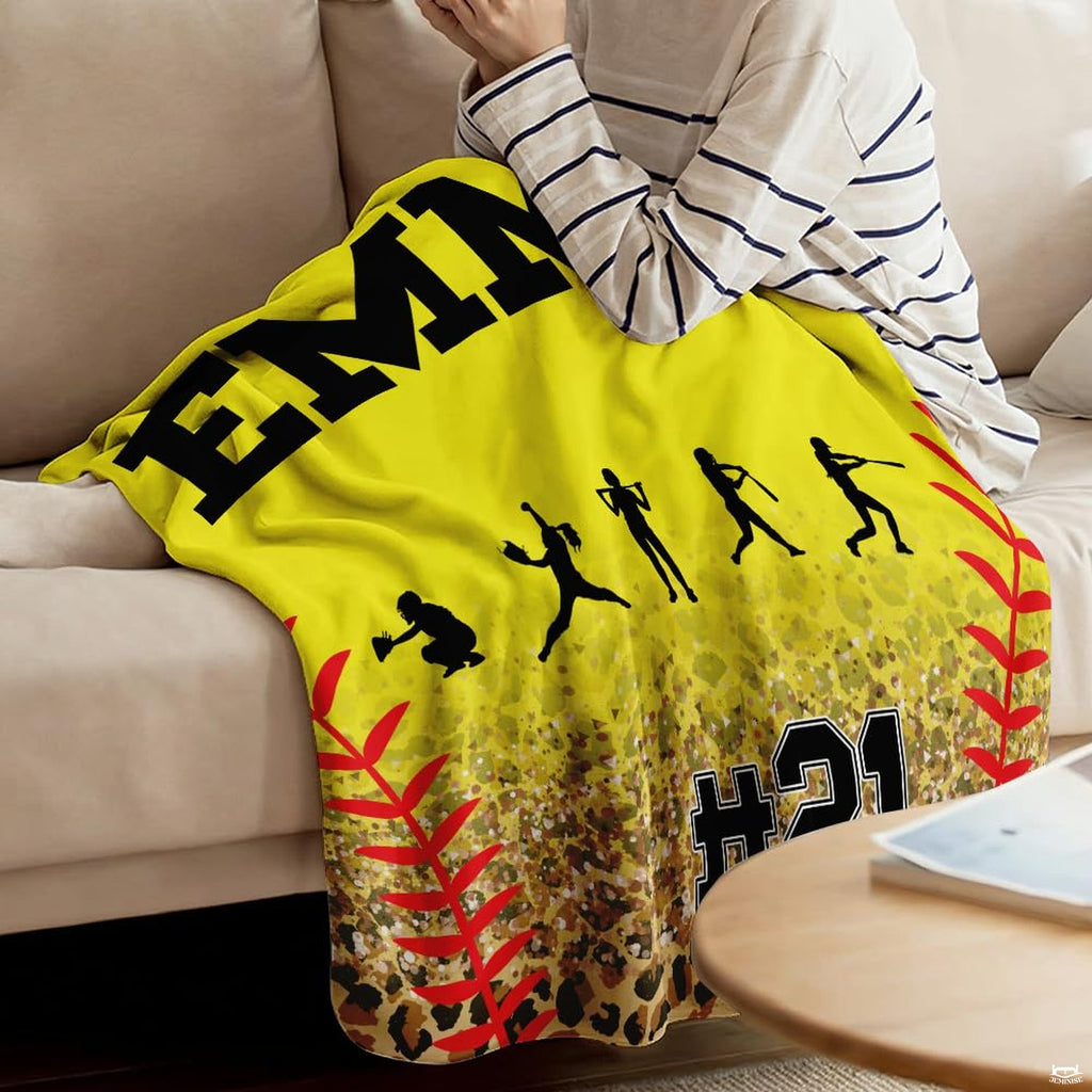 Folded athletic blanket highlighting yellow ball background and cheetah spots