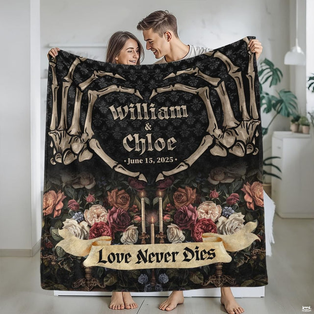 Close view of gothic floral bedding highlighting cream and red roses with candle art.