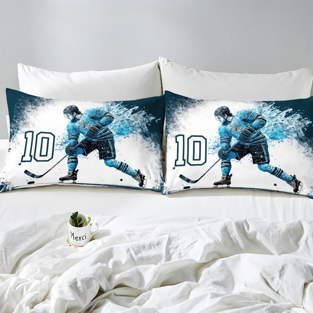 Side angle view of athletic winter sports bedding showing icy blue and deep navy tones draped on mattress