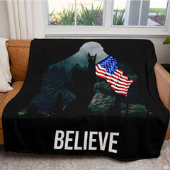 Detailed graphic view of moonlit pine trees and Stars and Stripes inside Sasquatch outline.