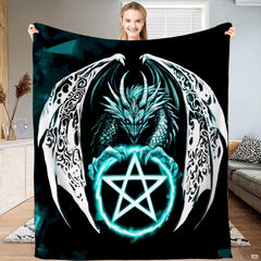 Gothic dragon throw blanket featuring an ice dragon with ornate filigree wings grasping a glowing cyan pentagram