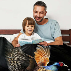 Overhead perspective of pheasant flight artwork on decorative bedding.