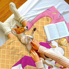 Neatly folded waffle cone softball throw blanket showcasing vibrant pink icing borders.