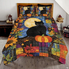 Autumn night black cat bedding featuring feline perched beside pumpkin under glowing moon on plaid patchwork