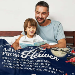 Close-up perspective of red cardinals on blossoming branch on memorial throw blanket